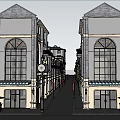 Charming Commercial Street With Storefronts Awnings Outdoor Seating And Street Lamps