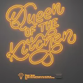 Yellow Neon Light Fixture With Queen of the Kitchen Lettering on Dark Wall