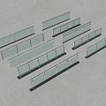 Multiple Glass Railings With Different Lengths And Various Designs Displayed On Grey Surface