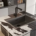 Modern Kitchen Sink With Black Faucet On Black And White Marble Countertop