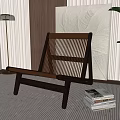 Elegant Leisure Chair With Wooden Frame Woven Design On Striped Rug Near Stack Of Books