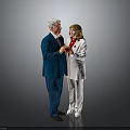 Two People In Formal Wear Blue Suit White Outfit Interacting With Items On Gray Background