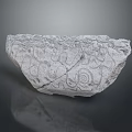 Ancient Stone Carving Fragment With Intricate Spiral Patterns And Textured Surface 3d model