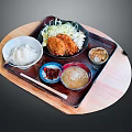 Traditional Japanese Tonkatsu Set Meal with Rice Miso Soup and Side Dishes on Wooden Tray