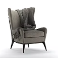 Modern Gray Armchair With Knitted Blanket And Black Wooden Legs