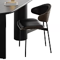 Black Oval Desk With Table Lamp Notebook Bottle And Wooden Back Leather Chair