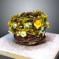 Household Decorative Woven Basket with Yellow White Flowers Green Foliage on Marble Surface