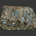 Wood Stone Natural Mineral With Blue Crystal Inclusions And Rough Surface Texture