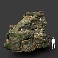 Giant Layered Rock Formation Covered With Green Moss And Human Figure Silhouette For Scale
