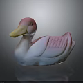Pink and White Duck Decorative Figurine With Yellow Beak And Textured Wings On Dark Surface