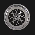 Shiny Silver Automotive Tire Rim With Modern Spoke Design And Center Logo