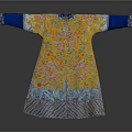Model Wearing Yellow Traditional Robe With Blue Cuffs And Intricate Floral Patterns