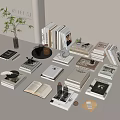 Books And Magazines On Minimalist Modern Desk With Stacked Open Book Teacup Plant And Decorations