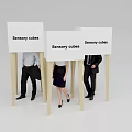 Sensory Cubes With White Panels And Wooden Poles Among Standing People