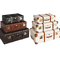 Vintage Leather Suitcases Stacked In Black Brown And White With Brass Corner Details