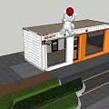 Two Story Orange And White Container Building With Lawn Steps And White Bear On Roof