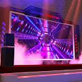 Futuristic Stage Setup With Large LED Screen Colorful Lighting And Cosmic Background