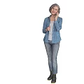 Elderly Woman In Blue Printed Jacket And Jeans Standing Against Gray Background
