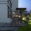 Nighttime Garden Landscape With Water Feature Fire Pit Stone Decorations Green Plants And Soft Lighting