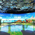 Modern Interactive Exhibition Space With Large Digital Screen And Projection Floor For Visitors
