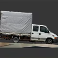 White Cargo Truck With Covered Bed And Canvas Tarp On Platform 3d model