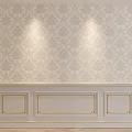 Cream And Gold Patterned Background Wall With Paneled Design And Decorative Trim Illuminated By Lights