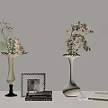 Elegant Tabletop Decor Setup With Vases Flowers Framed Pictures Books And Cup