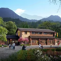 Traditional Homestay Building With Mountain View Green Trees And Courtyard Pond Area