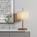 Elegant Table Lamp with Pleated Fabric Shade Wooden Pole on Marble Tabletop and Green Plant
