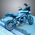 Black Sporty Motorcycle with Rearview Mirrors and Seat Parked on Roadside