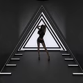 Modern Illuminated Triangle Art Installation With Woman Figure In Geometric Design