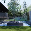Modern Entrance Gate In Landscaped Area With Trees Benches And Paved Walkway