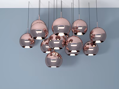 Modern Rose Gold Metallic Spherical Chandeliers Hanging Against Light Blue Wall 3d model