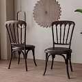 Dark Brown Dining Chairs With Slatted Backrest Decorative Wall Art Green Plant And Wooden Floor