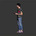 Man holding tablet in colorful striped T-shirt blue jeans and sneakers standing against gray background