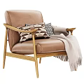 Modern Brown Leather Single Sofa With Wooden Arms Geometric Pillows and Light Colored Throw Blanket