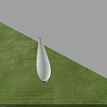 White Teardrop Shaped Outdoor Light Illuminating Green Grass And White Wall