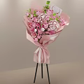 Fresh Pink Roses Hydrangeas Bouquet In Pink Wrapping Paper With White Ribbon On Black Tripod