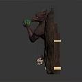 Dark Colored Carved Decorative Sculpture With Demon Figures Holding Green Object And Small Human Statues