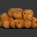 Orange Porous Stone Stack With Circular Holes On Dark Background