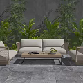 Outdoor Sofa Set With Rattan Armchairs Coffee Table And Green Plants Against Gray Wall