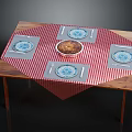 Wooden Dining Table With Red White Checkered Tablecloth And Blue Pattern Placemats