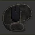 Black Computer Mouse Resting On Brown Ergonomic Mouse Pad Surface
