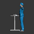 Surgeon in Blue Scrubs With Arms Outstretched by White Table and Medical Equipment