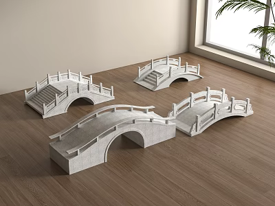 Four White Stone Arch Bridge Models Placed on Wooden Floor Near Window and Plant 3d model