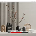 Black Vase With Branches On White Countertop Near Gray Mug Wooden Tray And Striped Wall