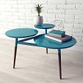 Blue Modern Round Coffee Table With Multi Tiered Tabletop Wooden Legs White Planter Plant Books