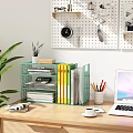 Green Metal Bookshelf in Home Office with Books Files Laptop Coffee Cup Pencils and Plant