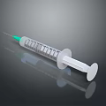 Transparent Plastic Syringe With Green Needle Graduated Scale And White Plunger