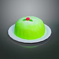 Fresh Green Cake on White Plate with Red Cherry and Green Leaf Topping